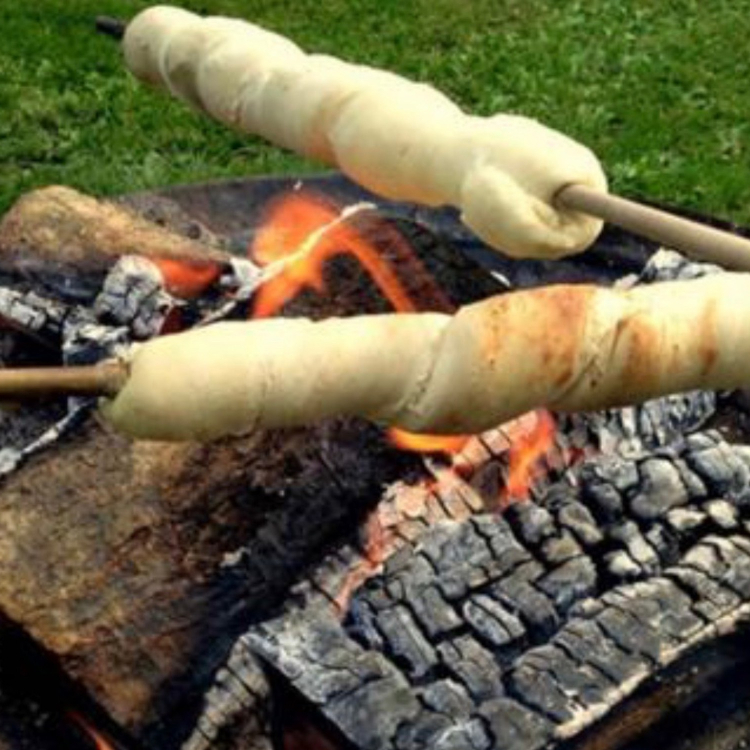 dough sticks over a fire